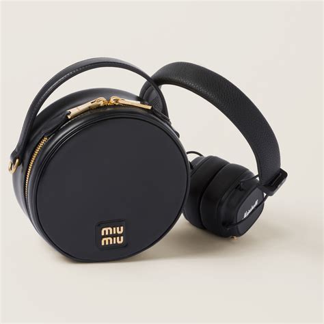 Marshall X Miu Miu headphones with leather case .